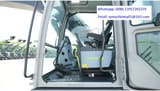 2026 Zoomlion ZE215G Crawler Excavator showing the spacious cab interior from a wider angle.