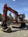 1997 O&K MH CITY wheeled excavator, front three-quarter view
