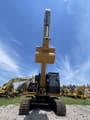 2023 Caterpillar 329D crawler excavator, front view with raised boom