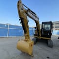2024 Caterpillar 306E2 mini excavator, front three-quarter view
