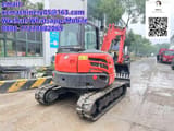 2023 Kubota KX057-4 mini excavator, rear three-quarter view