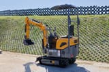 2025 APS KME10 Mini Excavator displaying the KME10 model marking on the side of the engine compartment.