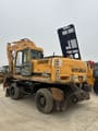 2020 Hyundai R210W-9 wheel excavator, rear three-quarter view