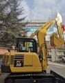 2025 Komatsu PC58 mini excavator side view