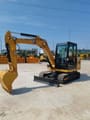 2022 Caterpillar 305.5 mini excavator, side view