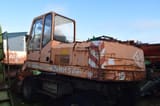 1990 O&K MH 5 wheel excavator, rear three-quarter view