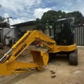 Komatsu PC-55MR mini excavator, front three-quarter view