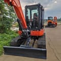 Kubota KX163-5 mini excavator, front view with blade