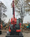 Kubota KX165 mini excavator, front view