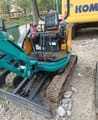 Kubota U-20 mini excavator, rear view of open operator station