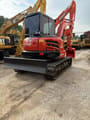 2020 Kubota KX165 WITH THUMB Mini Excavator with its dozer blade positioned at the front.