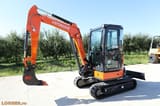 2025 Hitachi ZX33U-5A Mini Excavator showing the orange boom and arm with the Hitachi logo.