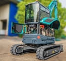 2026 Sunward SWE35UF Mini Excavator with a teal body and an open engine bay revealing internal components.