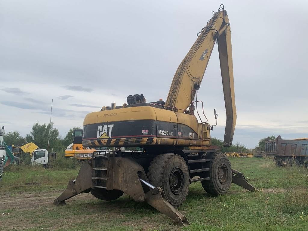 2005 Caterpillar M325C MH material handler, rear three-quarter view