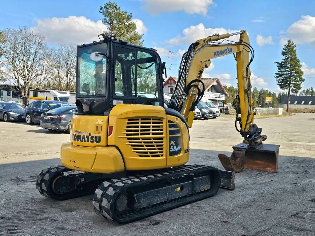 2020 Komatsu PC58MR-5E0 mini excavator, rear three-quarter view 2020 Komatsu PC58MR-5E0 mini excavator, rear three-quarter view