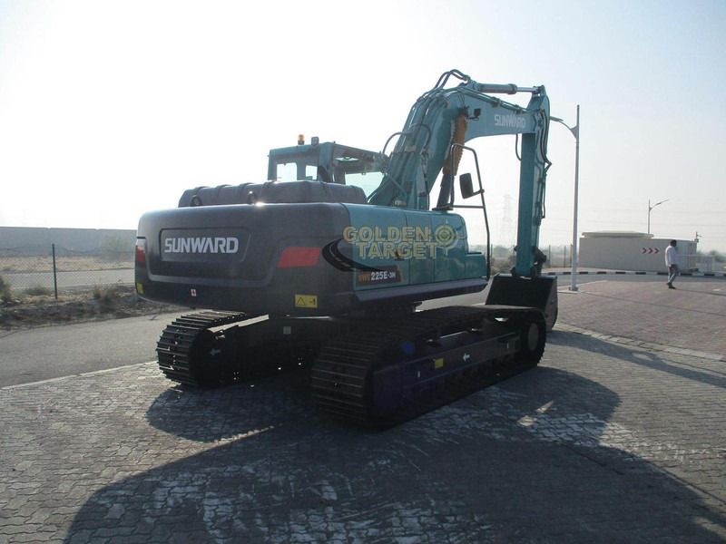 2024 Sunward SWE225E-3H Excavator from the rear, emphasizing the black tracks and undercarriage. 2024 Sunward SWE225E-3H Excavator from the rear, emphasizing the black tracks and undercarriage.