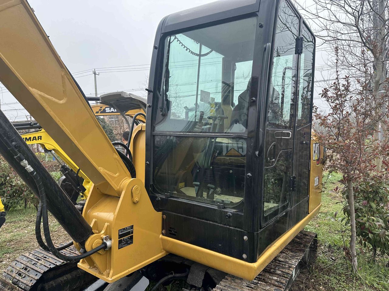 2021 Caterpillar 306 mini excavator, side view of the cab