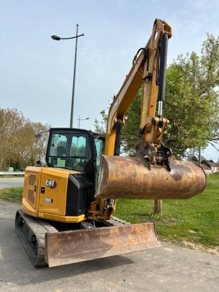 2024 Caterpillar 305 mini excavator, front three-quarter view
