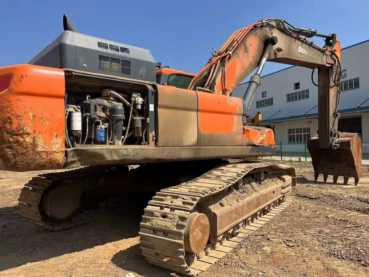 2022 Doosan DX420LC crawler excavator, side view with open engine compartment 2022 Doosan DX420LC crawler excavator, side view with open engine compartment