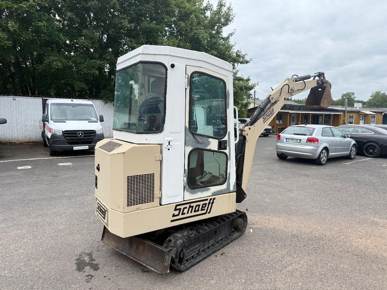 1995 Schaeff HR 12 mini excavator, rear three-quarter view