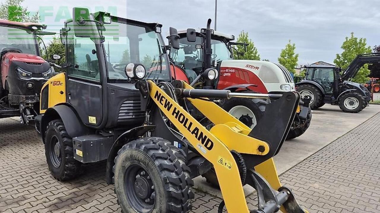 2020 New Holland W60 C mini excavator, front three-quarter view 2020 New Holland W60 C mini excavator, front three-quarter view