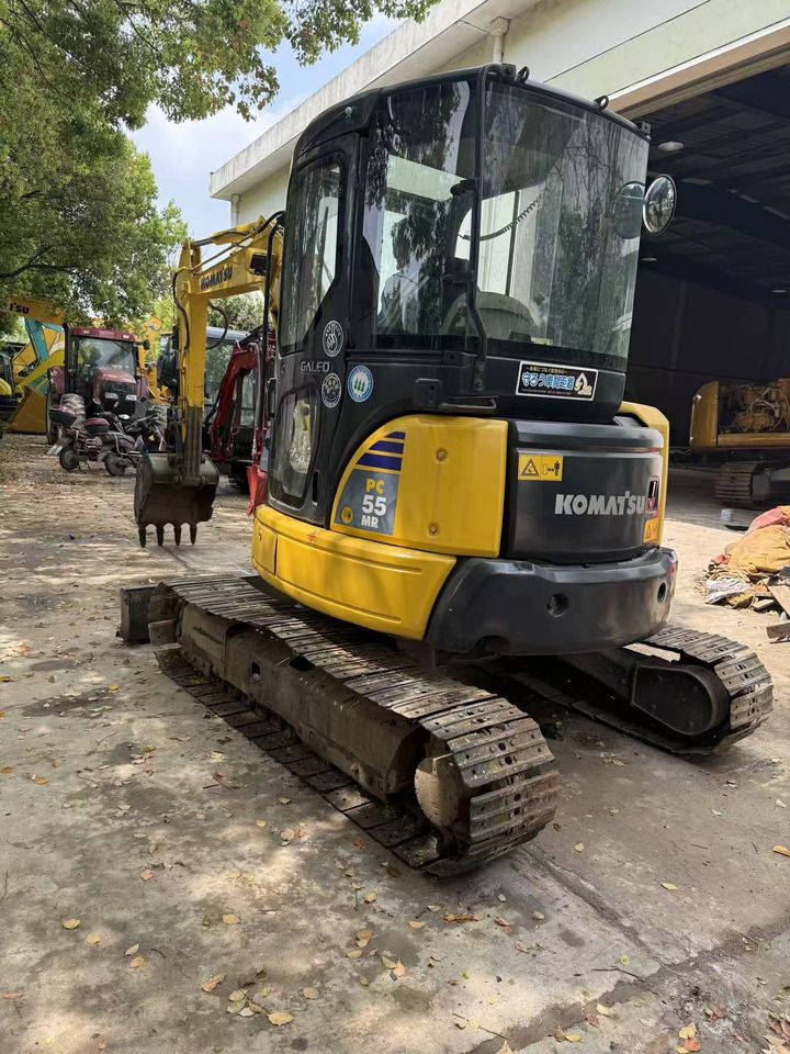 2012 Komatsu PC-55MR mini excavator, rear three-quarter view 2012 Komatsu PC-55MR mini excavator, rear three-quarter view