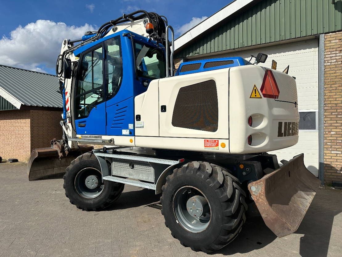 2015 Liebherr A914 wheel excavator, rear three-quarter view 2015 Liebherr A914 wheel excavator, rear three-quarter view