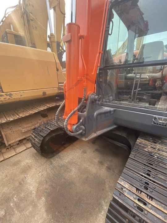 2018 Doosan DX60 crawler excavator, side view of cab and boom base