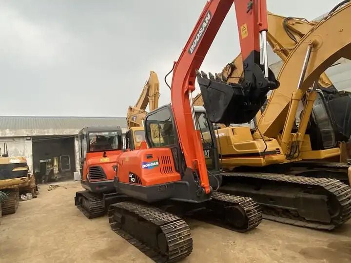 2020 Doosan DX60 crawler excavator, front three-quarter view 2020 Doosan DX60 crawler excavator, front three-quarter view