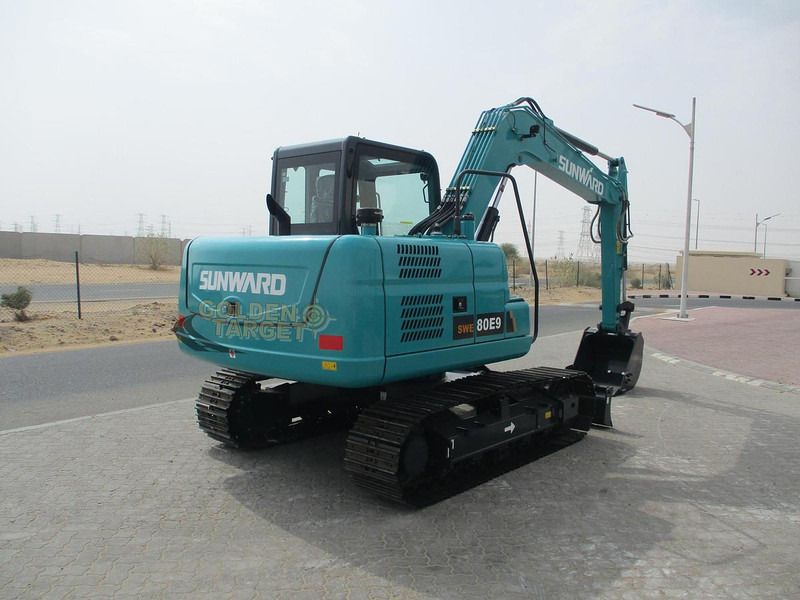 2025 Sunward SWE80E9 Mini Excavator, teal colored, displaying the rear counterweight with visible model markings. 2025 Sunward SWE80E9 Mini Excavator, teal colored, displaying the rear counterweight with visible model markings.