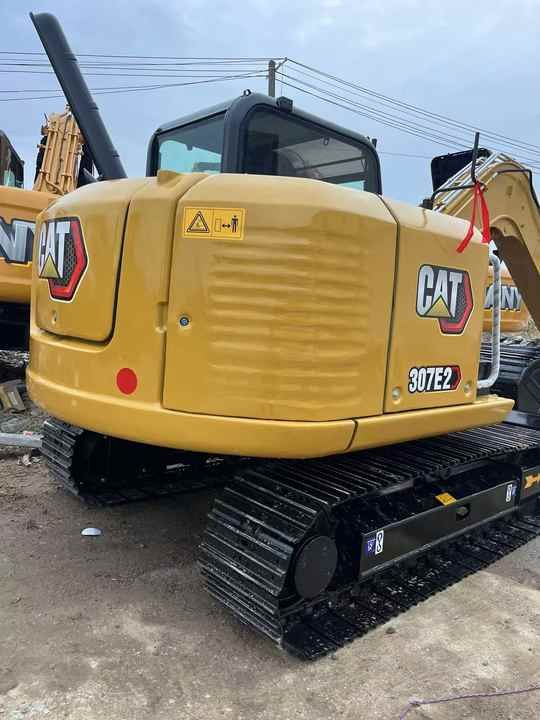 2023 Caterpillar 307E2 crawler excavator, rear three-quarter view