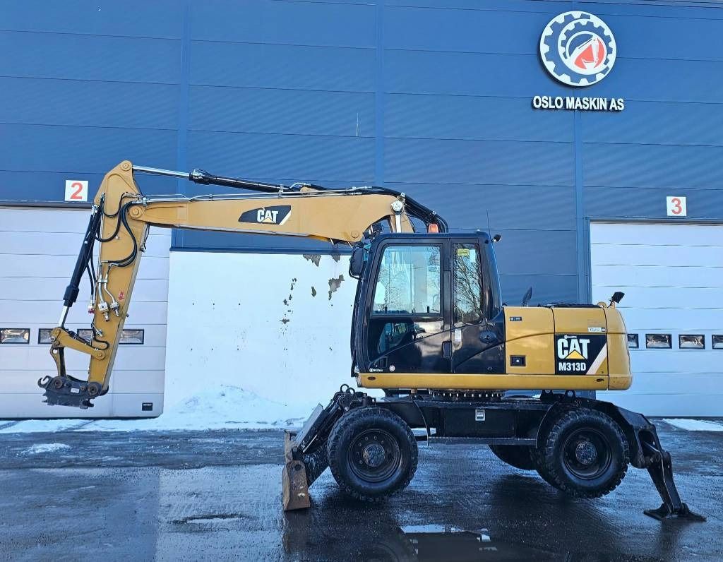 2012 Caterpillar M313D wheel excavator, side profile view