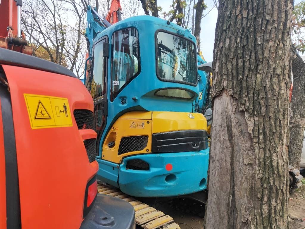 2023 Kubota KX135-3S mini excavator, front three-quarter view