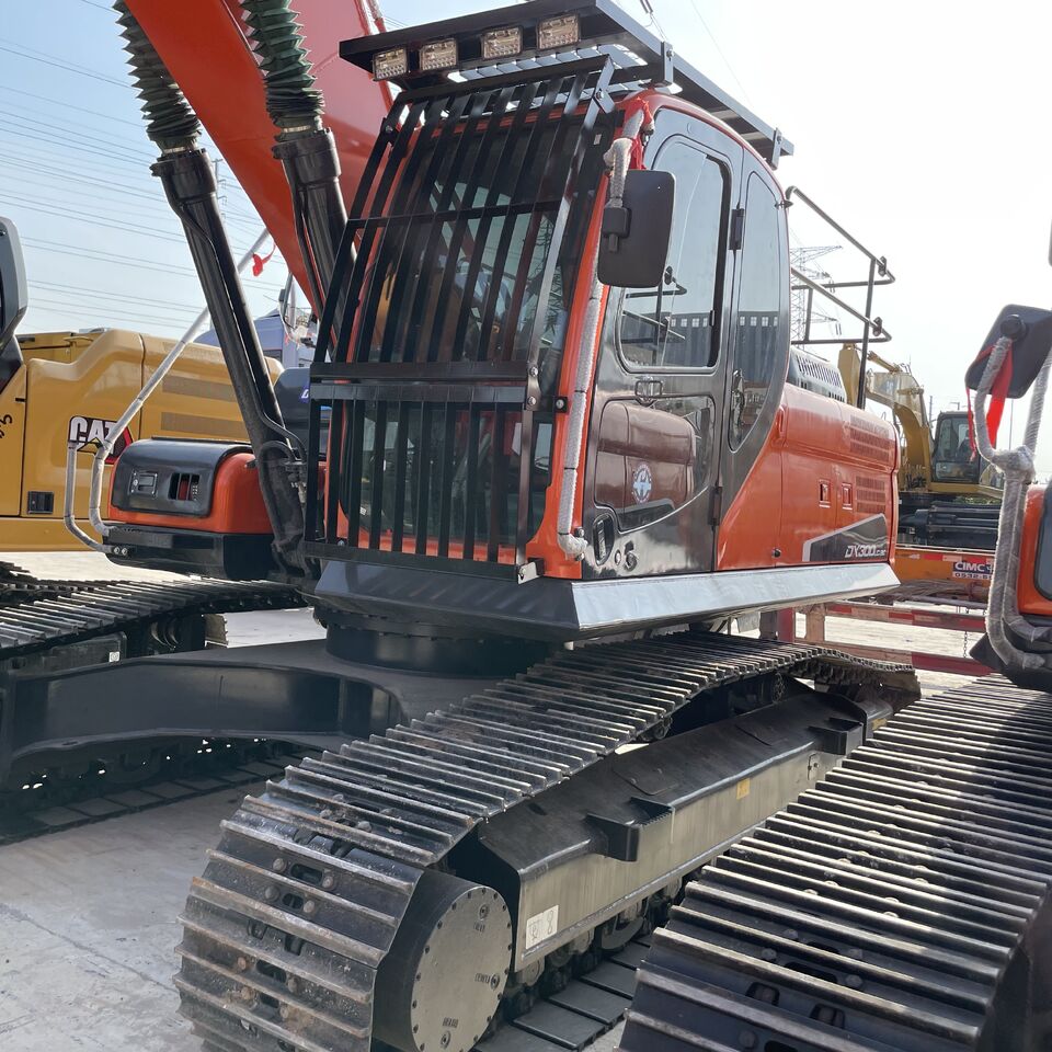 Doosan DX300 crawler excavator, side view of the cab and tracks Doosan DX300 crawler excavator, side view of the cab and tracks