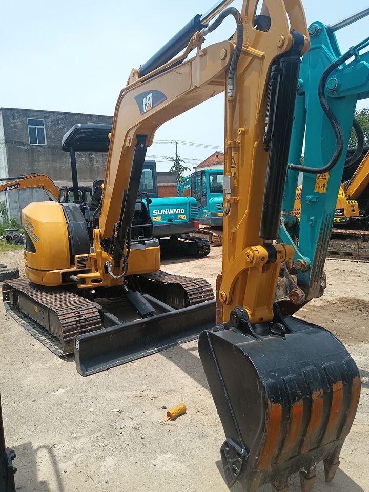 2024 Caterpillar 304C mini excavator, front three-quarter view