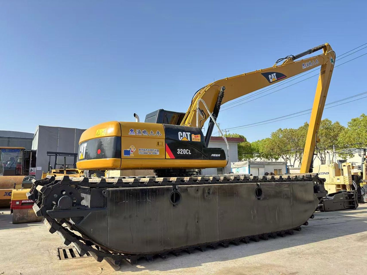 2016 Caterpillar 320CL amphibious excavator, side view