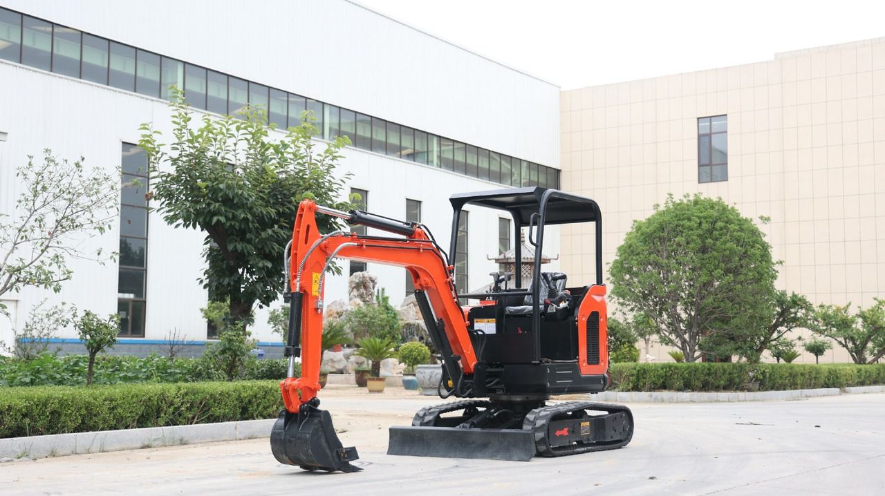 2024 Müller Machinery MB 25-VKSH Mini Excavator with a bright orange boom and a black open canopy, viewed from the side.