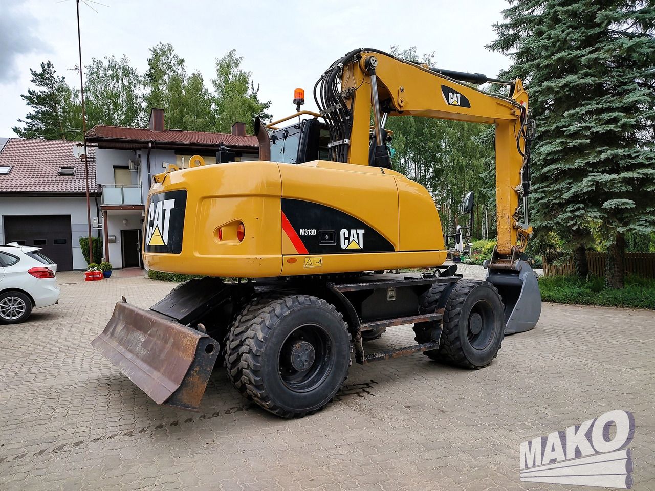 2016 Caterpillar M313D wheel excavator, rear three-quarter view