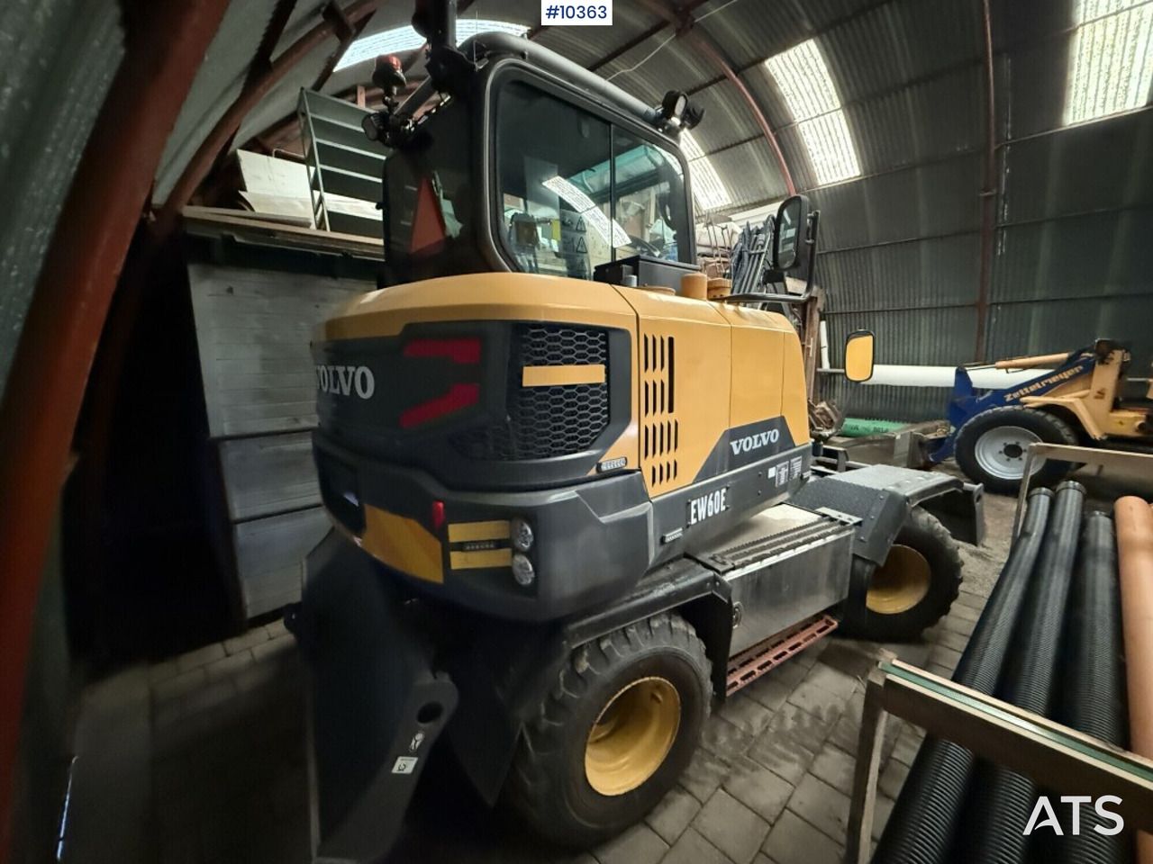 2016 Volvo EW60E wheel excavator rear three-quarter view
