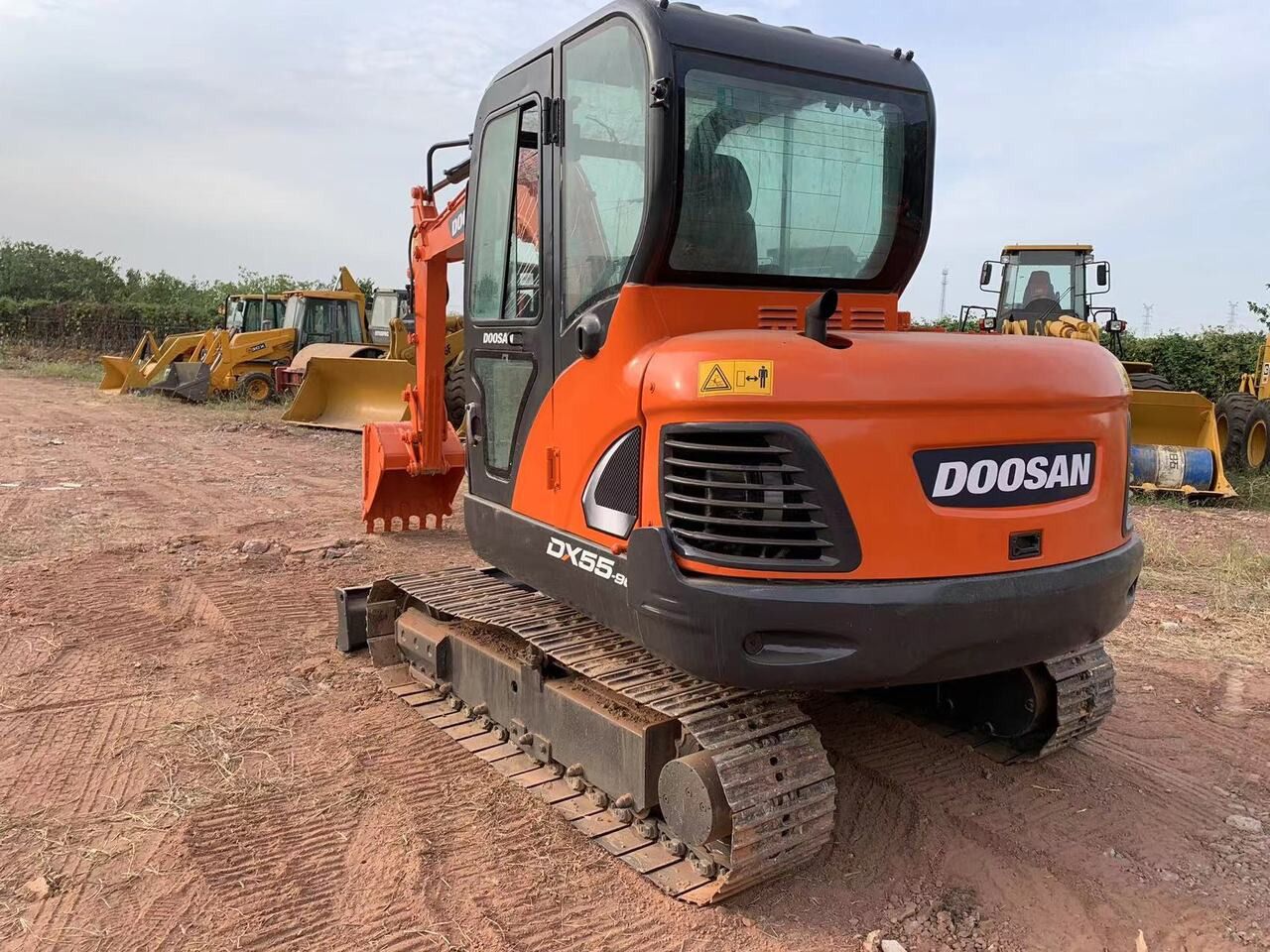 2018 Doosan DX55-9C excavator, rear three-quarter view 2018 Doosan DX55-9C excavator, rear three-quarter view