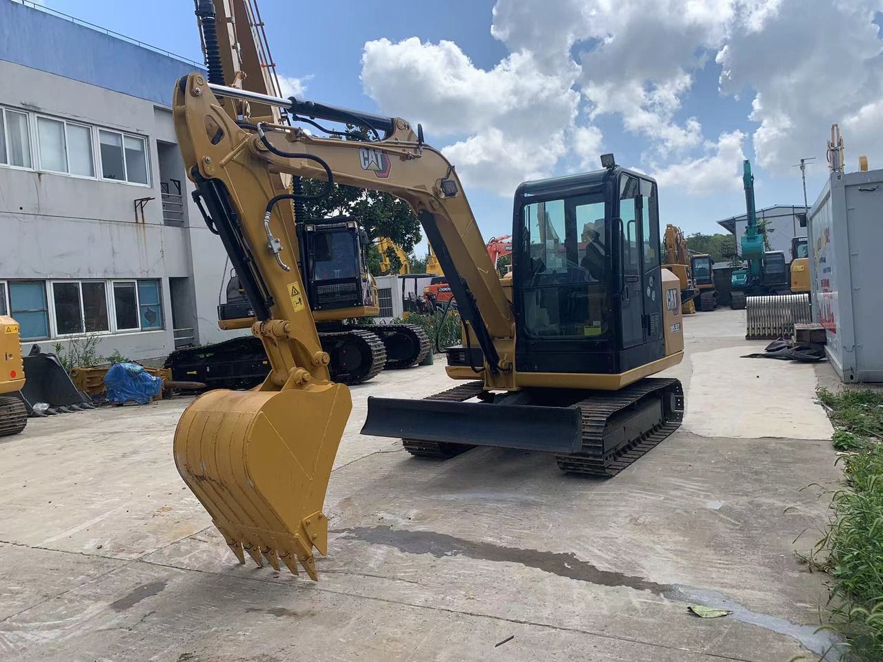 2022 Caterpillar 305E2 mini excavator, front three-quarter view