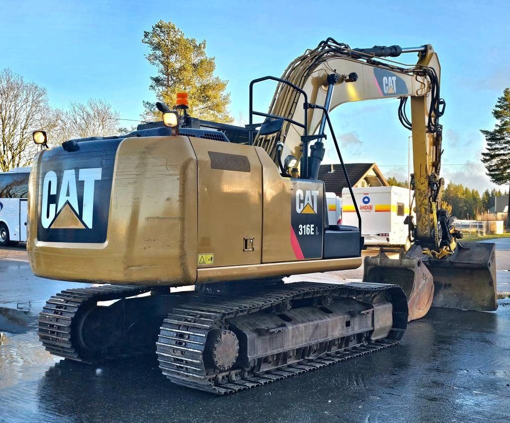 2012 Caterpillar 316EL crawler excavator, rear three-quarter view