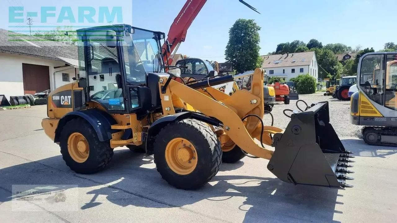 2017 Caterpillar 908M wheel loader, front three-quarter view 2017 Caterpillar 908M wheel loader, front three-quarter view