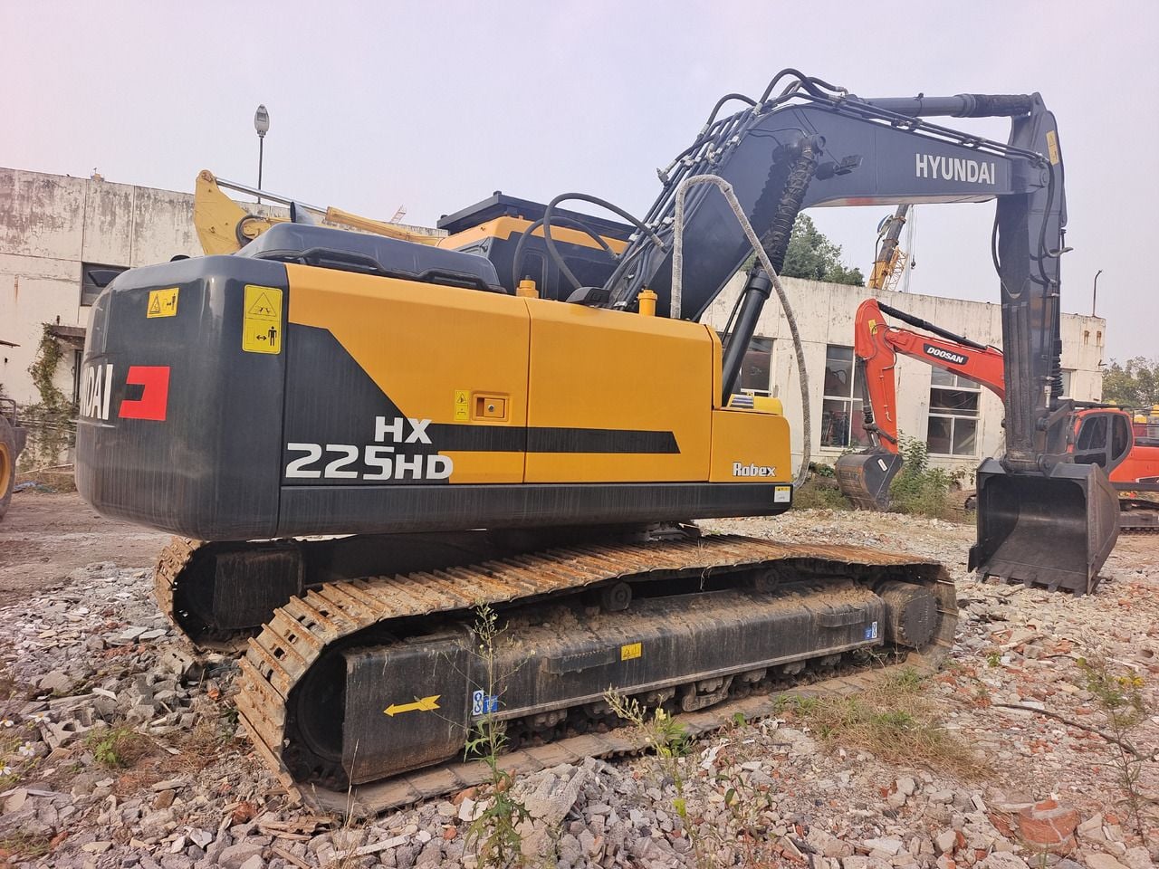 2024 Hyundai HX225HD crawler excavator, rear three-quarter view