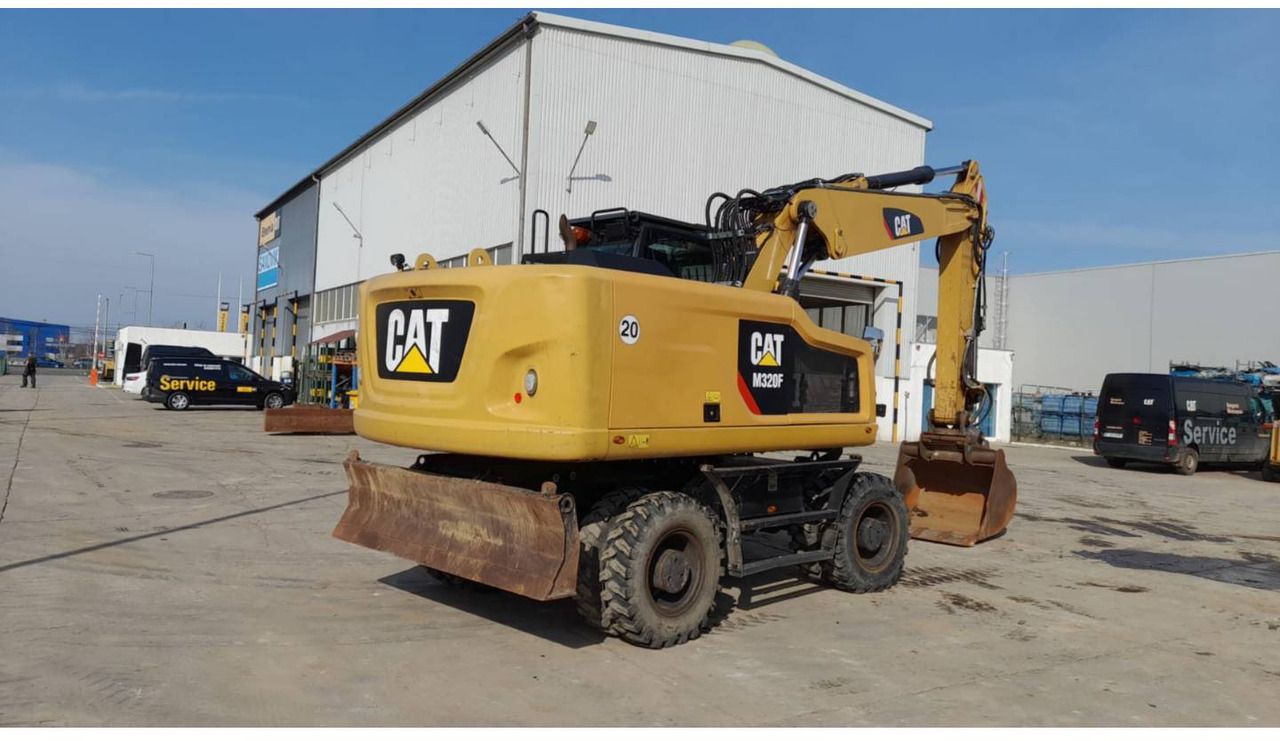 2016 Caterpillar M320F wheel excavator rear three-quarter view