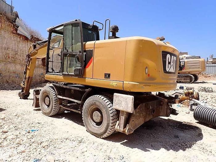 2016 Caterpillar M320F wheel excavator, rear three-quarter view