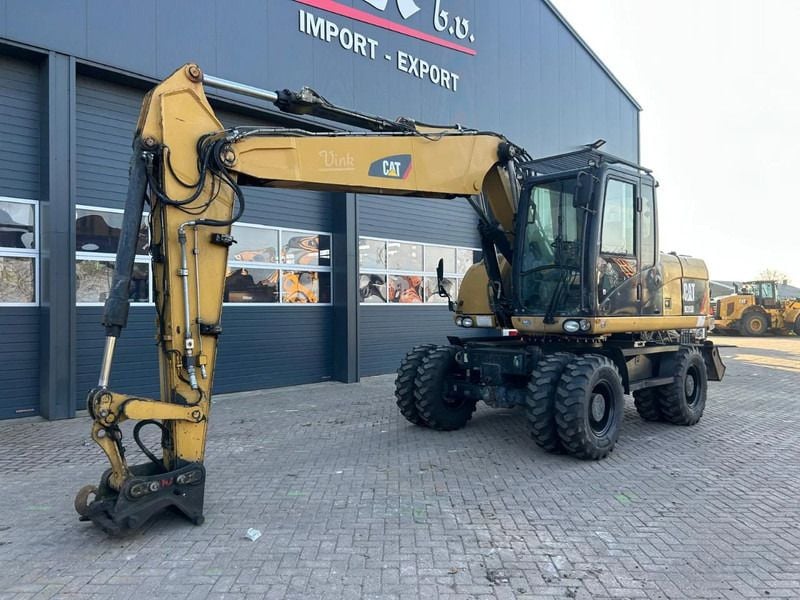 2011 Caterpillar M315D wheel excavator, side profile view 2011 Caterpillar M315D wheel excavator, side profile view