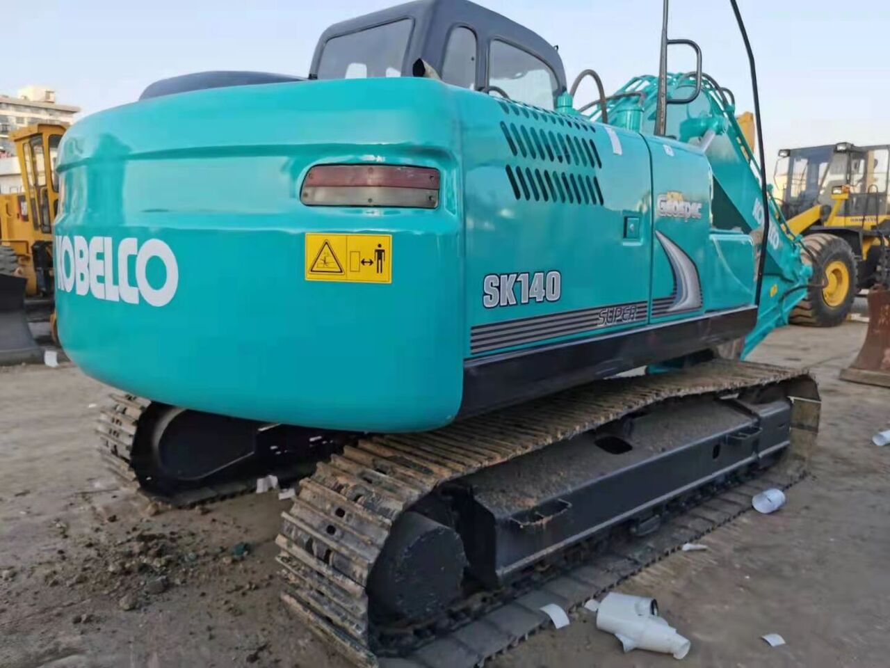 2022 Kobelco SK140-8 crawler excavator, rear three-quarter view