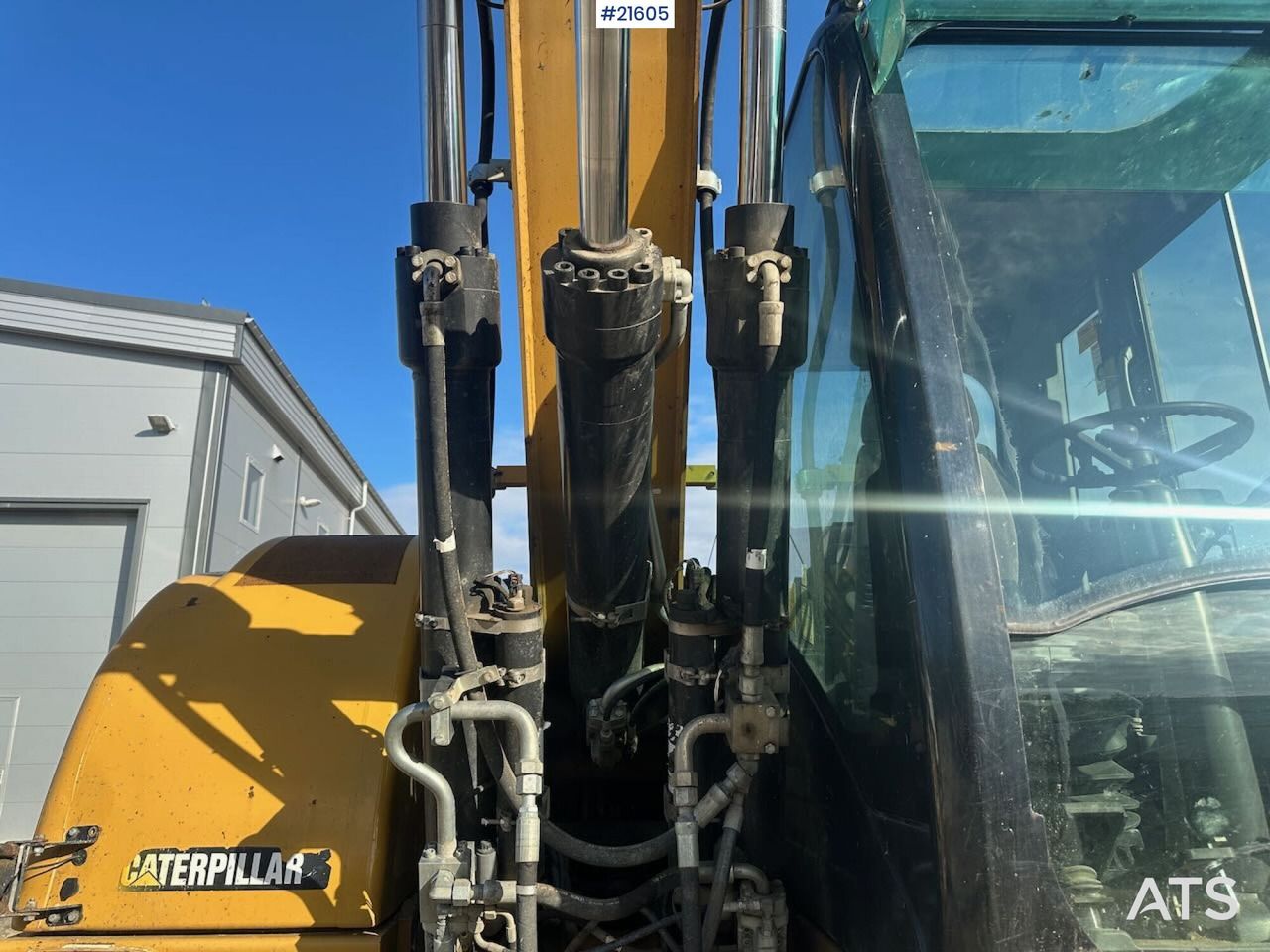 2012 Caterpillar M313D wheel excavator cab and boom detail