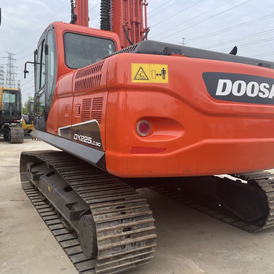 2022 Doosan DX225LC-9C crawler excavator rear three-quarter view